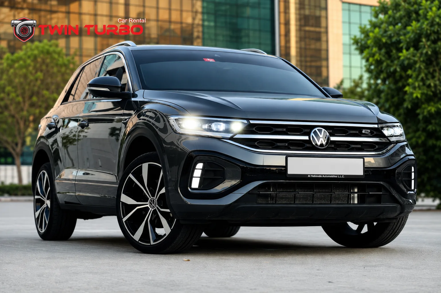 Volkswagen Touareg R SUV in black parked outdoors with headlights on.